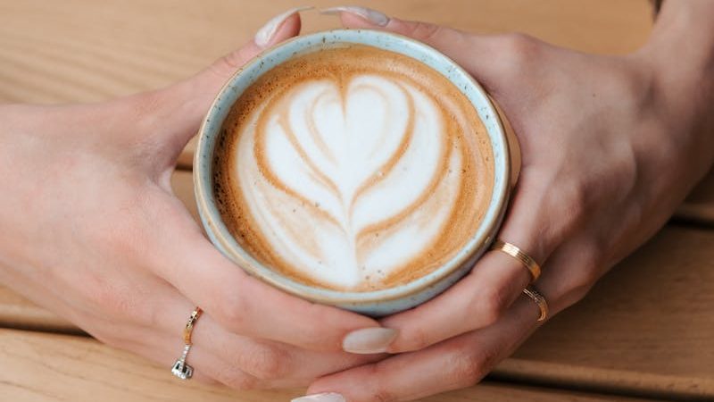 Cup of Cappuccino in Hands